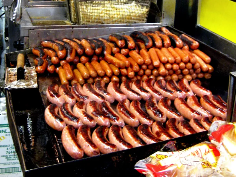 Half-smokes loaded with chili and onions at Ben's Chili Bowl, the defining Washington, D.C. dish.