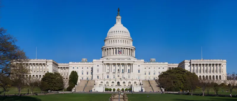 The United States Capitol and its dome under a clear sky